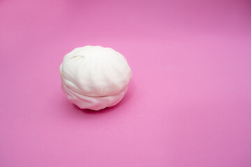 Marshmallow from two halves on a pink background