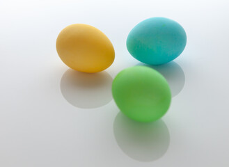 Close-up. Colored Easter egg on a white background. Easter holiday.