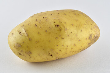 image of a raw uncoooked baking potato