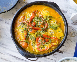 Brazilian seafood fish stew ( moqueca) cooked in a terracotta casserole a common dish found in the Northeast part of Brazil, especially in the state of Bahia. 