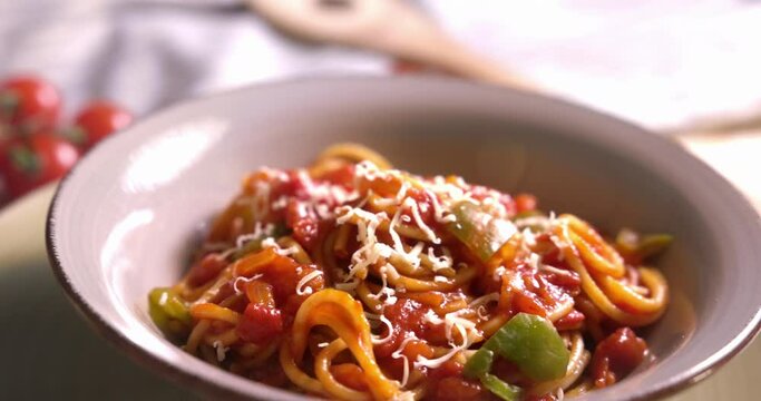 Bowl of pasta pomodoro with tomato sauce and parmesan cheese