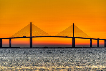 Sunrise behind bridge