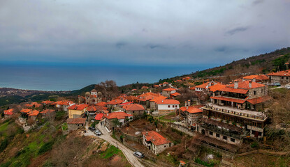 Fototapeta na wymiar Aerial panoramic view of Paleos Panteleimonas Village. It is an old picturesque village in the prefecture of Pieria. It is built at an altitude of 1100 meters on the eastern slopes of Mount Olympus