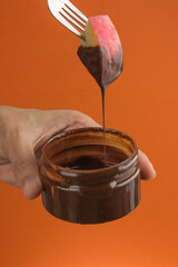 Cut apples fruit and dip them into butter chocolate