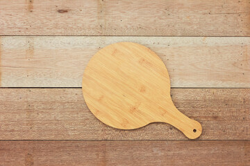 Plate to put food on it with wooden background.
