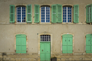 Fototapeta na wymiar Typical facade architecture of a french townhouse in the small village of Ebreuil in Auvergne (France)