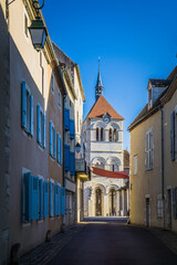 View on carolingian church and the streets of Ebreuil, a small village in Auvergne, France