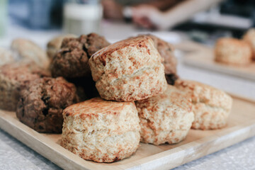 Delicious scones with Strawberry Jam and Clotted Cream on white table. English pastries concept. A...
