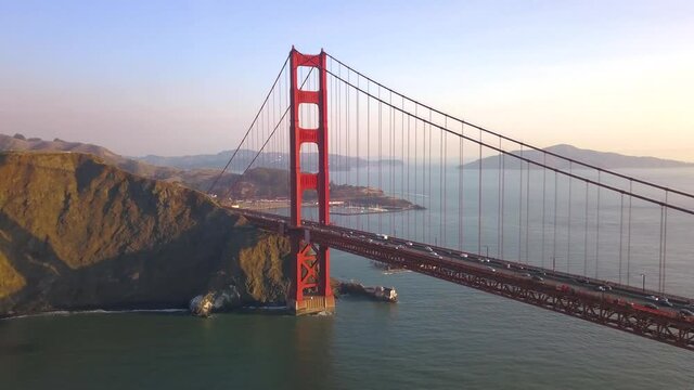 Beautiful Sunny Day and Sunset over San Francisco and the Golden Gate Bridge. Very unique and rare drone aerial footage of California's iconic bridge over the bay.