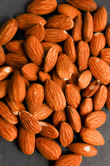 Almond nut on top of wooden block. 
