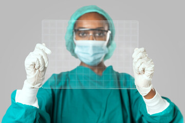 Doctor holding futuristic transparent tablet screen with design space