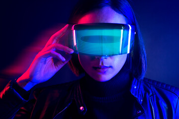 Woman in glasses augmented reality blue