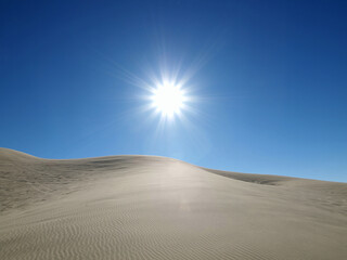 Blazing sun at Dumont Dunes near Death Valley in the Mojave Desert area of Southern California.  