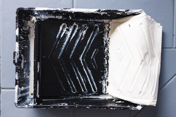 paint tray with solidified dry paint getting removed in one layer, DIY and home improvement