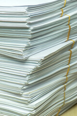 bundles bales of paper documents. stacks packs pile on the desk in the office