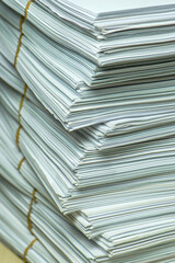 bundles bales of paper documents. stacks packs pile on the desk in the office