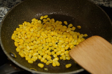 Yellow Corn Niblets in a frying pan