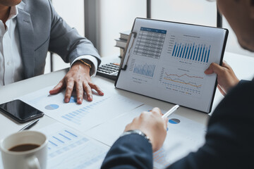 Businessman meeting and working with financial report, talking about business plan for investment,...
