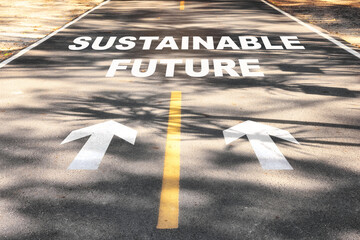 Sustainable future word on asphalt road surface with marking lines. Inspiration and motivation concept and effort idea