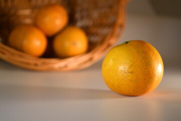 fresh orange on the white table background