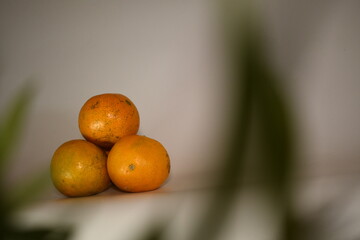 fresh orange on the white table background