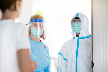 Fototapeta premium Doctor examining sick patient at home.