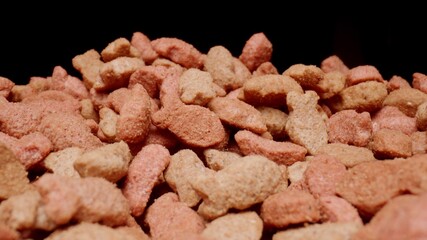 MACRO: Cat food on a black background