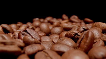 MACRO: Coffee beans on a black background