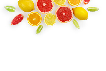 Flat lay composition with citrus fruits, leaves and flowers on white background, copy space.