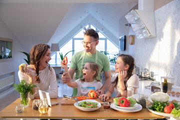 Family cooking in the kitchen at home