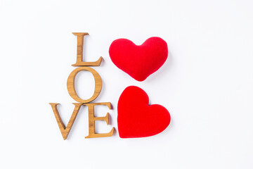 Happy Valentine's day card background idea, love wooden font with two red heart on white...
