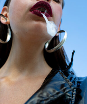 Female domination. Woman spit. Fetish. BDSM concept. Submissive.