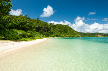 Crystal clear water and mountains make the perfect Iida beach backdrop for a swim. Iriomote Island.