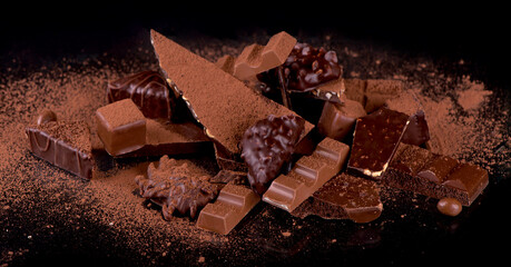 dark chocolate over wooden background, selective focus