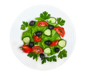 Vegetables salad with slices cherry tomato cucumber black olives with parsley and lettuce top view. The concept of healthy food and dieting. 