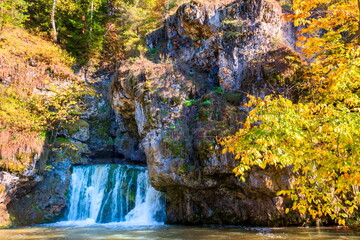 the famous waterfall atysh flowing from a karst funnel in the Ural mountains of Bashkortostan on an...