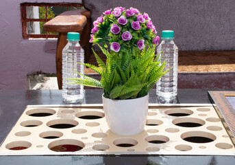 FLOWER POT ON TABLE FOR GUEST OR MEETING