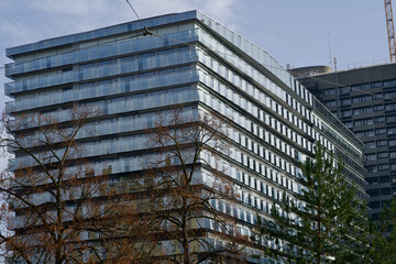 Facade of hospital at Zurich, Switzerland with autumn tree in the foreground.