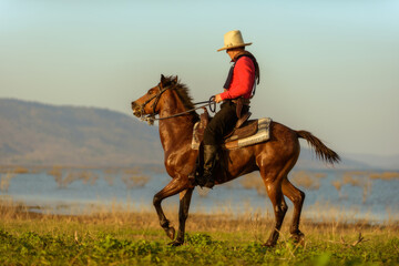 Western cowboys riding horses 