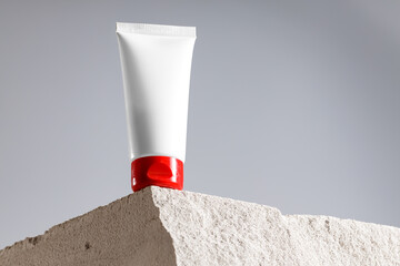 Skincare cosmetic jar on gray cinder block