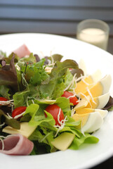 Detail of a bowl with hard boiled eggs and salad
