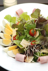Detail of a bowl with hard boiled eggs and salad