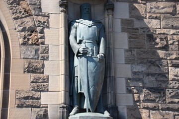 statue with face in shadow