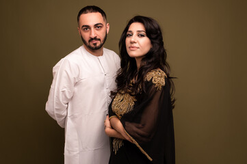 Muslim woman and man. Close up Portrait of a young arab girl and man in traditional dress. 