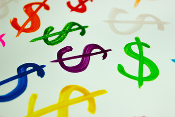 Pattern from colored symbols of dollar, background from watercolor paints