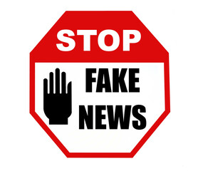 Stop fake news, text written on a stop hand signal.
	