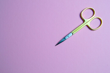 manicure scissors on a pink background