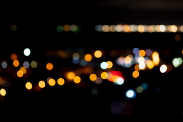 Night city lights in blur of bokeh style background