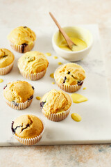 Homemade blueberries muffins with lemon frosting. Food background with copy space. Selective focus.