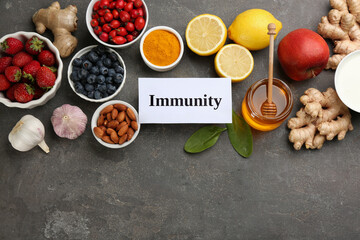 Card with word Immunity and fresh products on grey background, flat lay. Space for text